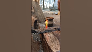 Watch how an old piece of iron is heated in coal and forged into a nail by hand."