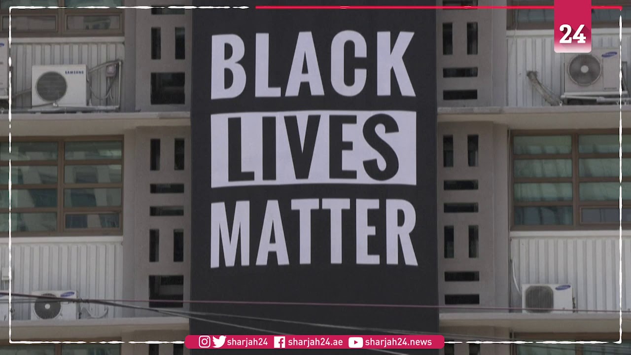 Black Lives Matter banner hangs outside US Embassy in South Korea - YouTube