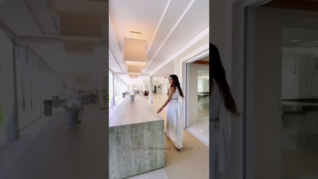 Flowing water waterfall floor-to-ceiling glass windows