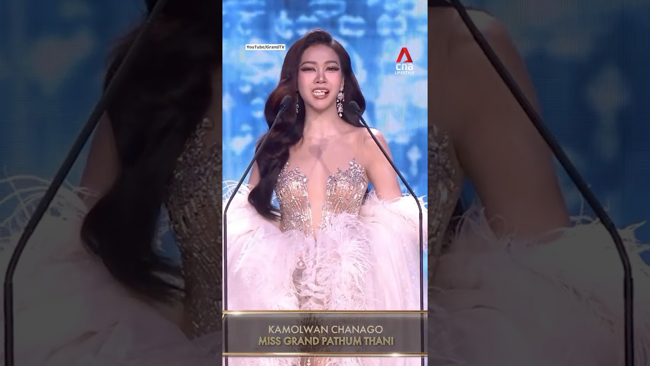 Thai beauty pageant contestant calmly recovers after her fake teeth fall out on stage