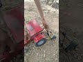 Mahindra tractor toy on small farm