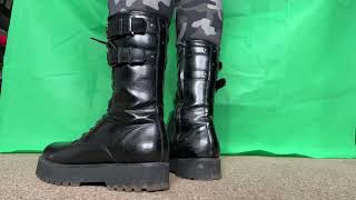 Black Leather Combat Boots On Feet And Crushing