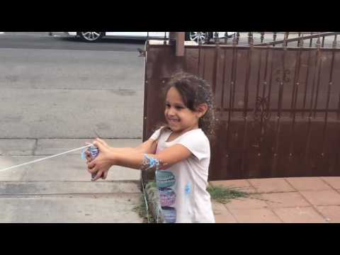 Julian and Leilani play with silly string