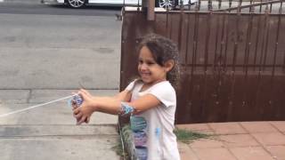 Julian and Leilani play with silly string
