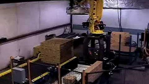 Palletizing system utilizing clamp type end of arm tooling and case upender