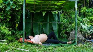 Pregnant homeless single mother starving and desperate carrying her unborn child in the deep forest