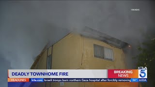 Woman dead, 3 others hospitalized after Panorama City townhomes burst into flames