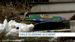 Boy, 6, on sled hit by car, critically hurt