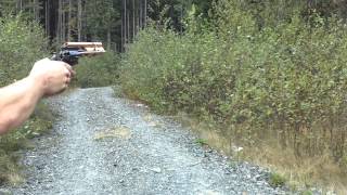 Gas ejecting revolver in action.