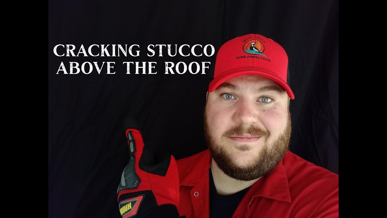 Cracking stucco on parapets above the roof.