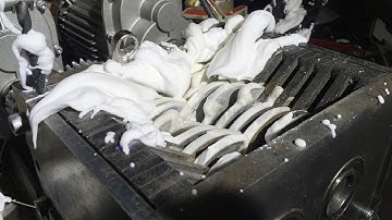 Shaving foam explosion in shredder, in super slow motion