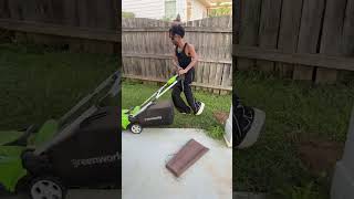 Finally mowing the backyard with my lil leg