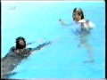 couple jumping in the pool