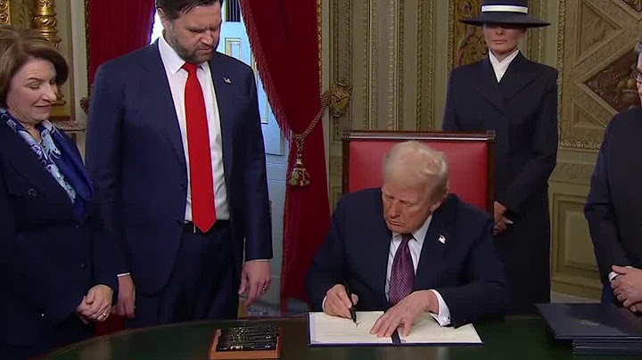 President Trump signs a series of executive orders during first day in office