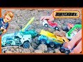 Mini diggers and trucks playing in the dirt