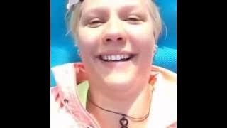 Finnish girl laughing by herself in public