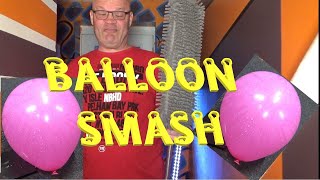 Smashing Black Balloon with a B&M floor noodle Mop Warning very loud
