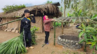 Orphan boyFence around the house,cut palm leaves and bamboo to build a roof to cover the water tank