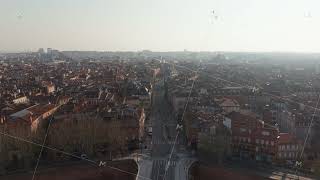 Toulouse daybreak illuminating terracotta rooftops, historic buildings bathing in soft morning screenshot 2