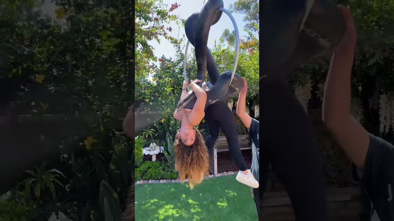 Who looks more comfortable rainbow snake or pretty girl 