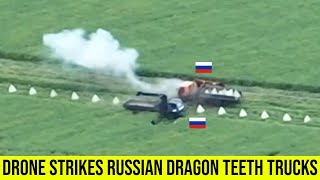 Ukrainian drone strike Russian trucks loaded with dragon teeth blocks.