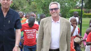 Hon. President Helmut Kutin arrives at SOS Children`s Village Entebbe amidst cheers and and dancing