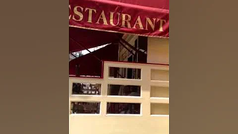 Mother and Son singing at Parisian cafe