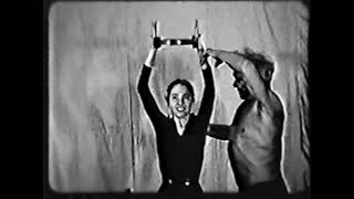 Joseph Pilates teaching Eve Gentry in 1956.