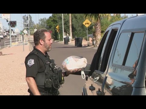 Turkeys not tickets: Mesa police officers surprise drivers with holiday cheer