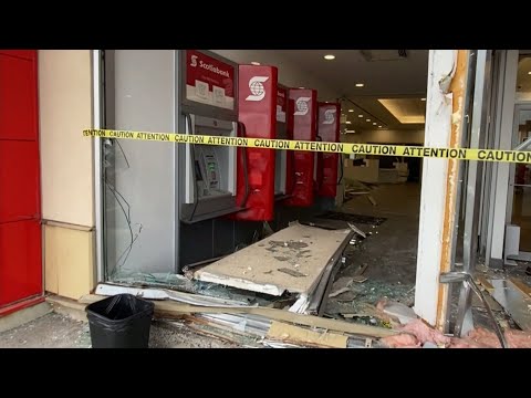 Two people injured after car smashes through an Ottawa bank