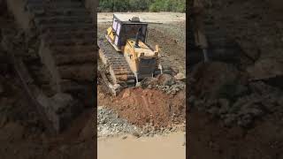 Expert operator KOMATSU D60E dozer pushing rock clearing pond, 15 ton trucks transport soil #short