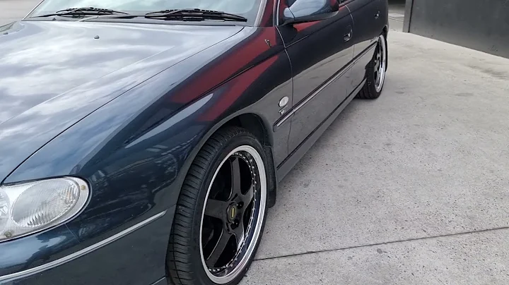 Holden Calais fitted with Simmons FR-1 rims in gloss black w/polished lip walkaround