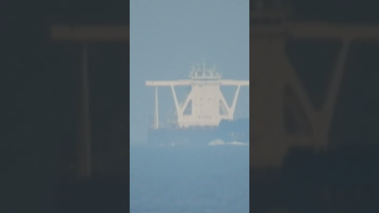 ULCC & fishing boat. 