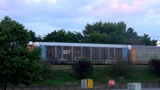 CSX Auto Rack Train Roars By on Raised Tracks
