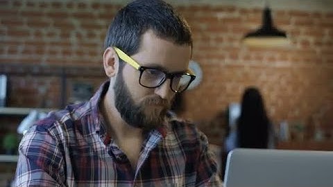 Focused Bearded Man Using Computer Stock Video