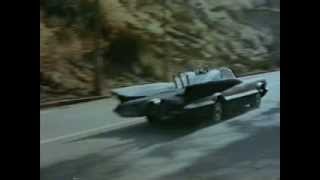 Early flat black white striped Batmobile in premier episode