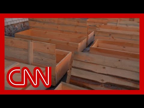 Makeshift coffins stand ready for the dead in Chernihiv