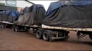 reverse of a VOLVO FH 520 truck towed to three complete trailers. b...