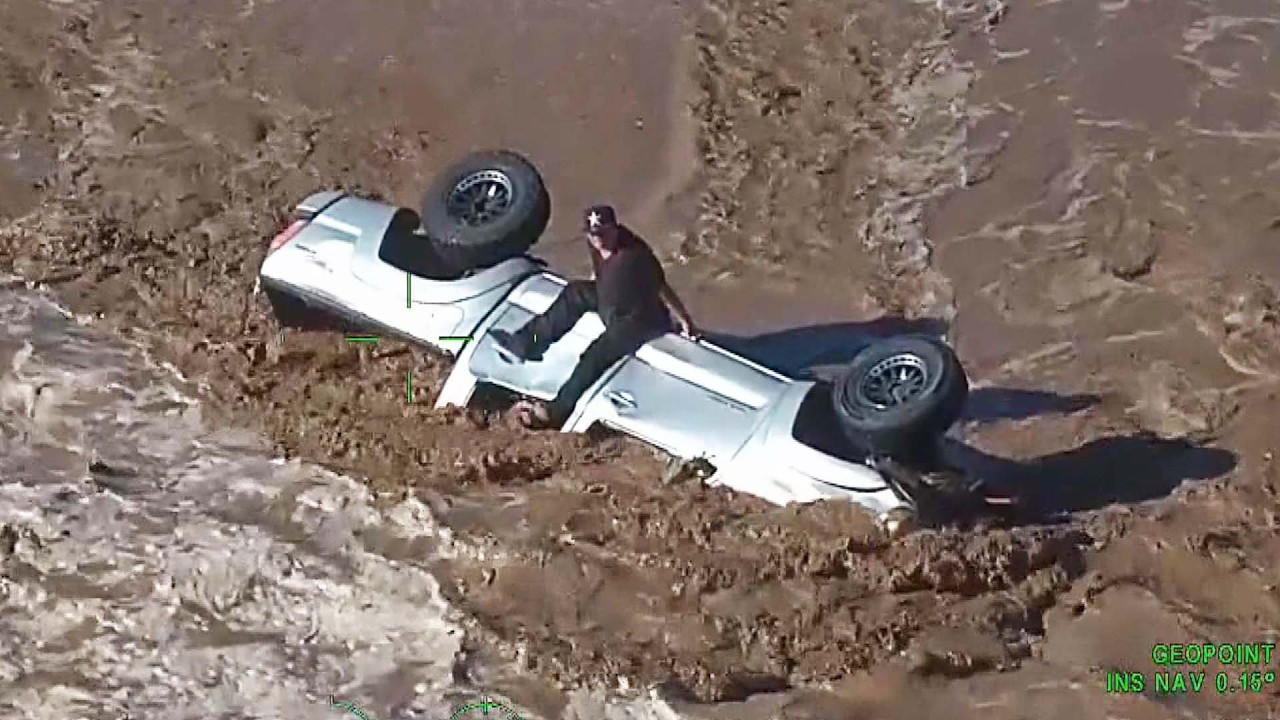 Driver Airlifted To Safety After Car Swept Away By Flood