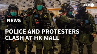 Hong kong police used pepper spray to disperse small groups of
demonstrators and reporters inside a mall on tuesday at rally marking
the one-year anniversa...
