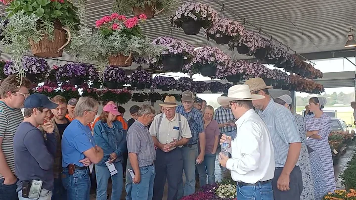 Auctioneer Linford Berry Selling Flowers At The Sh...