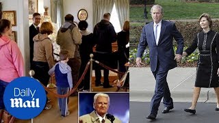 George W Bush and wife Laura pay their respects to Billy Graham - Daily Mail