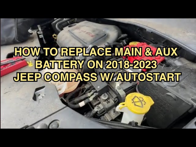 Where is the Auxiliary Battery in a 2018 Jeep Compass