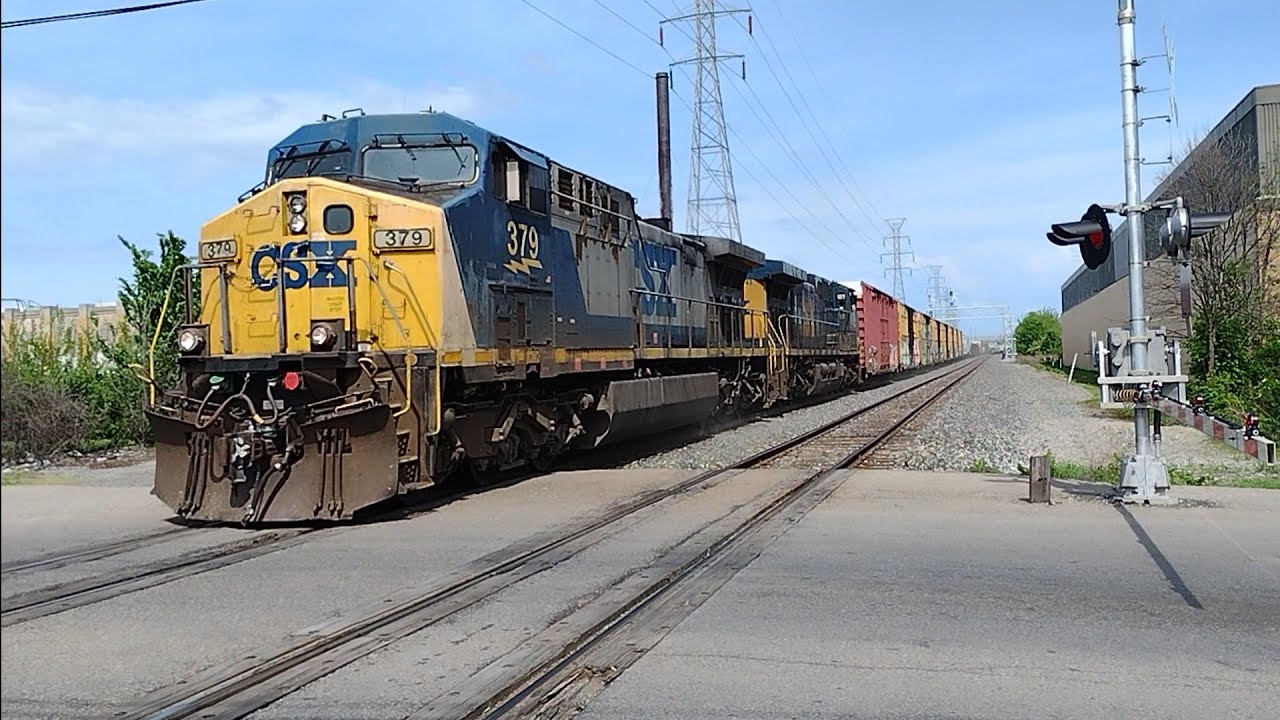 CSX 379 & CSX 242 CW44AH leads the CSX L302-21 on the CSX Detroit sub with a rare passenger car