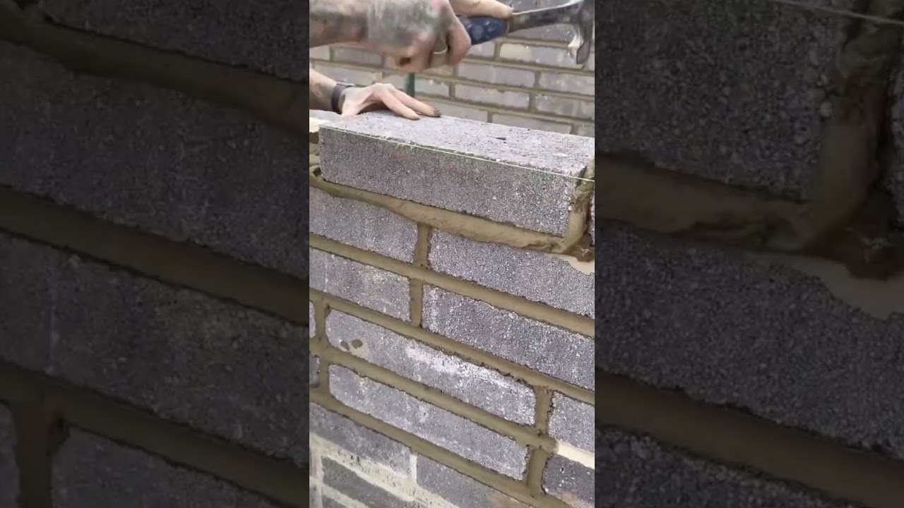the process of installing bricks in building a house fence