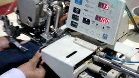 AUTOMATIC LOOP ATTACHING MACHINE