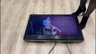 Girl crush flat TV with high heels boots