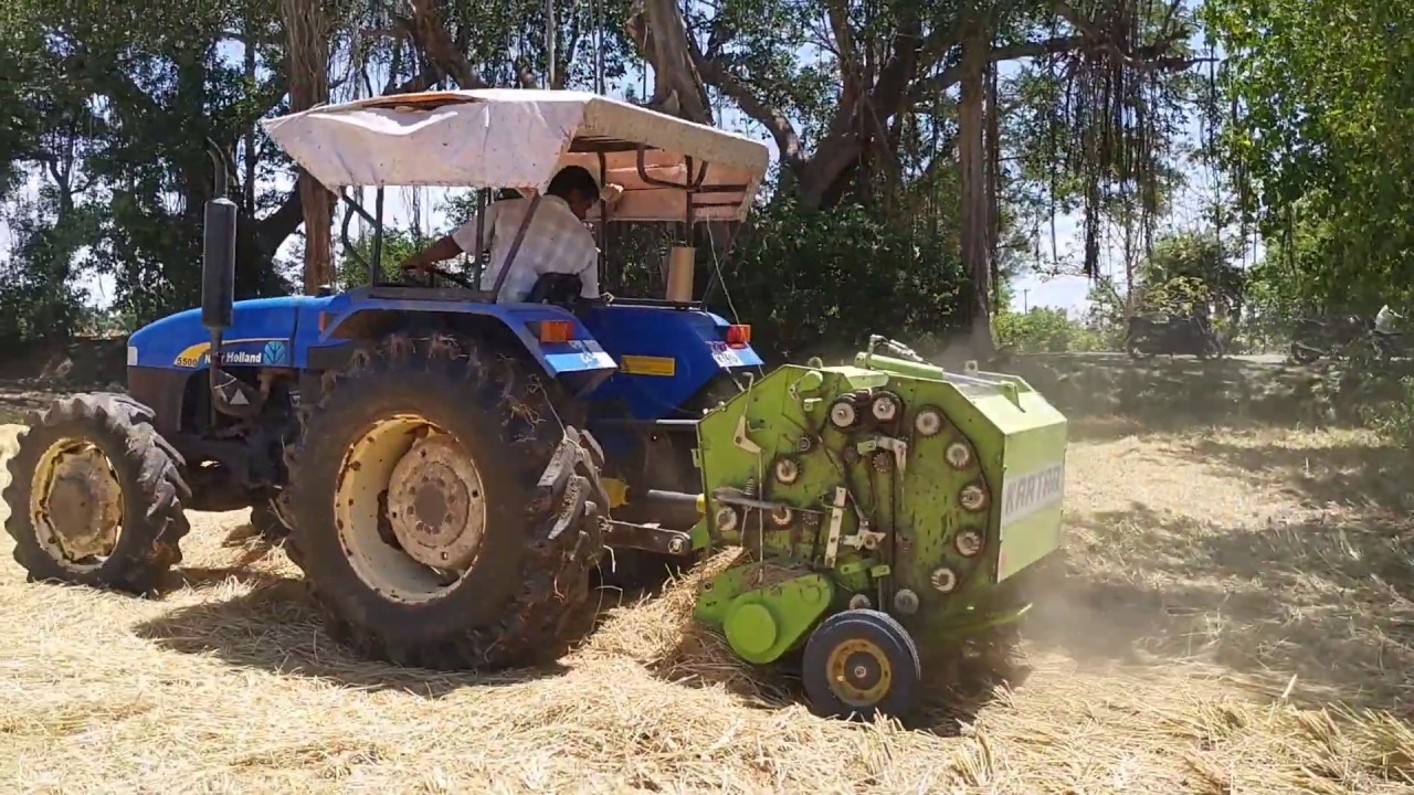 Kartar Round Straw Baler with New Holland 5500 Tractor Performing in