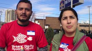 Protesters march in front of hotel for minimum wage