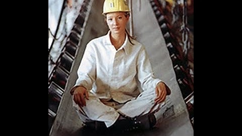 Underground man riding conveyor belt